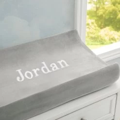 Delta Children Personalized Contoured Changing Pad With Plush Cover -Kid Household Items EM201270 5000 Changing Pad Embroidered Cover Lifestyle 102